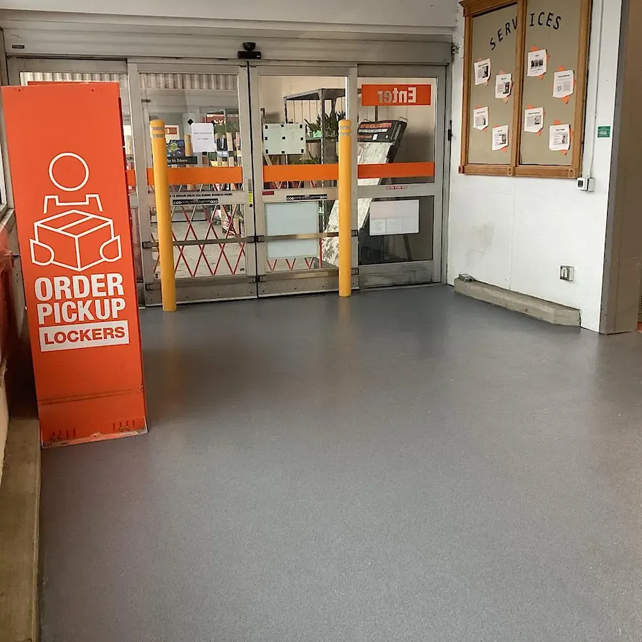 Industrial epoxy flooring installation in a commercial warehouse by L&L CONTRACTORS INC.