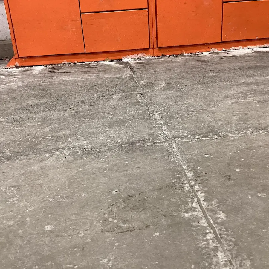 Technical crack repair in concrete floor before applying epoxy resin.
