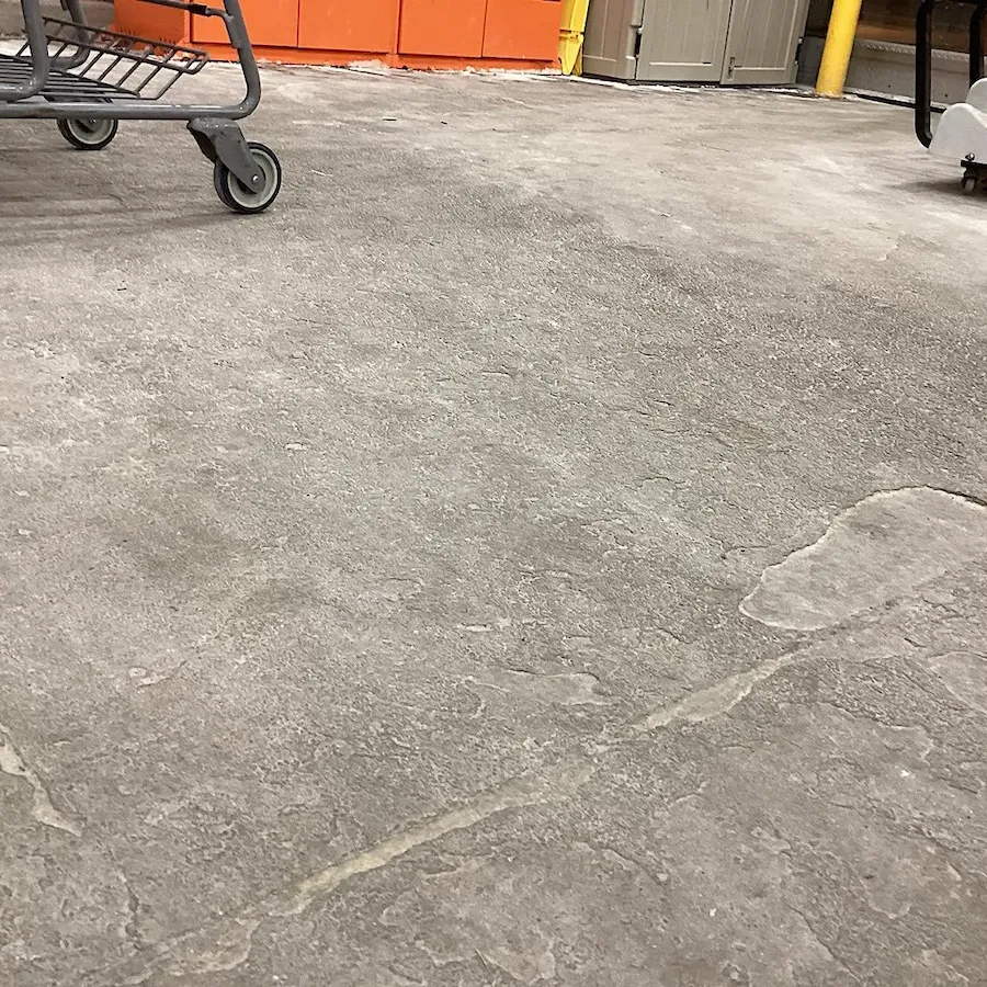 Deep concrete surface preparation for professional epoxy floor installation.