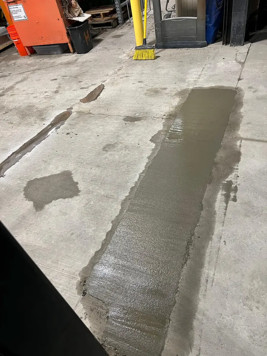 Finished, textured, and uniform surface over repaired trench in commercial concrete floor, professional work by L&L Contractors Inc.