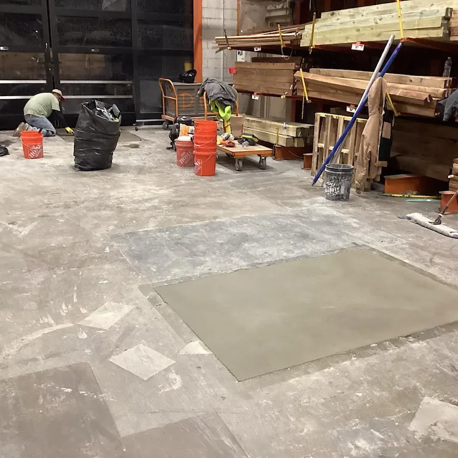 Pouring fresh concrete for floor patching, executed by experts at L&L CONTRACTORS INC.