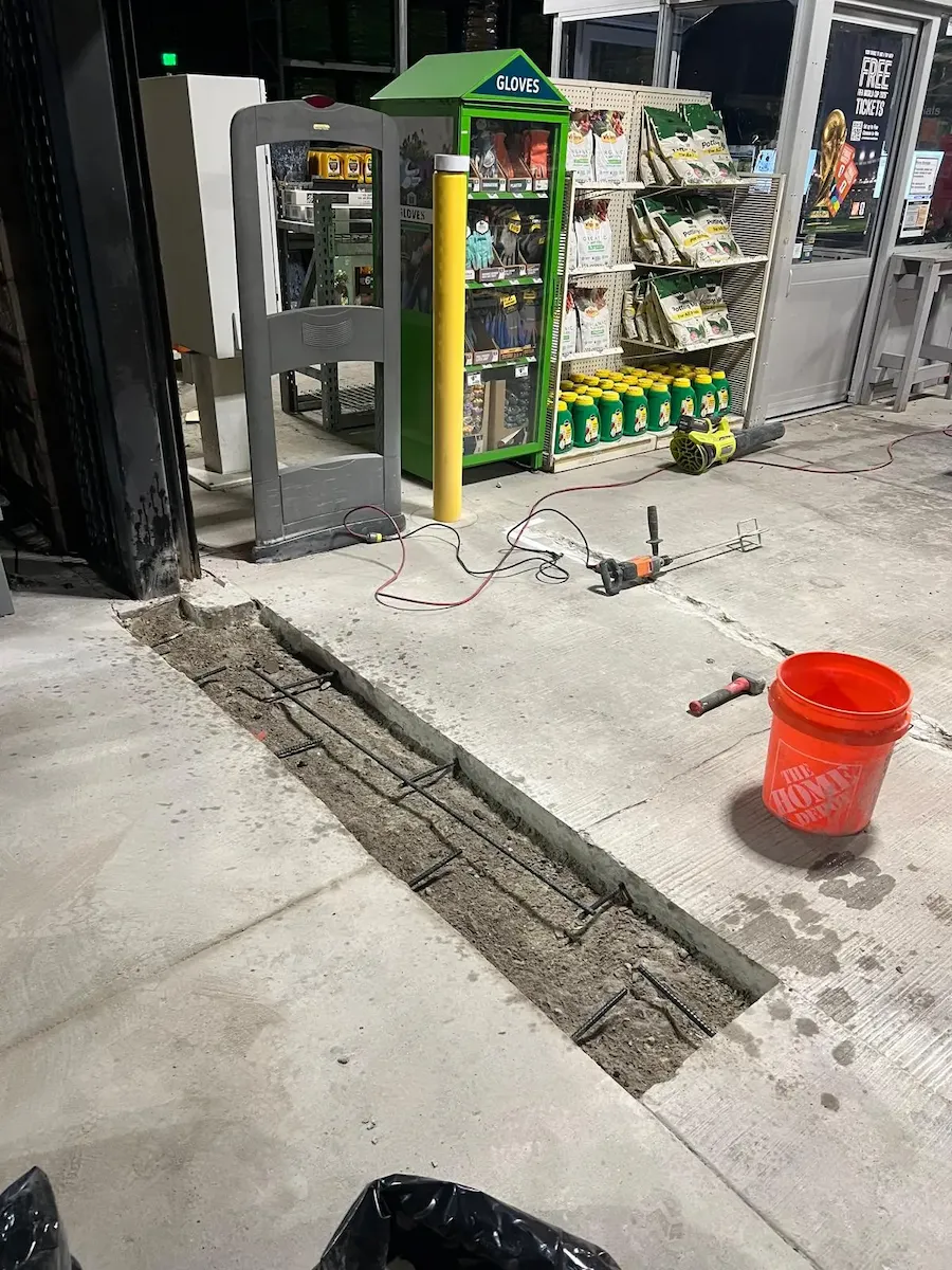 Precise installation of steel rebar for structural reinforcement of an industrial concrete floor repair.